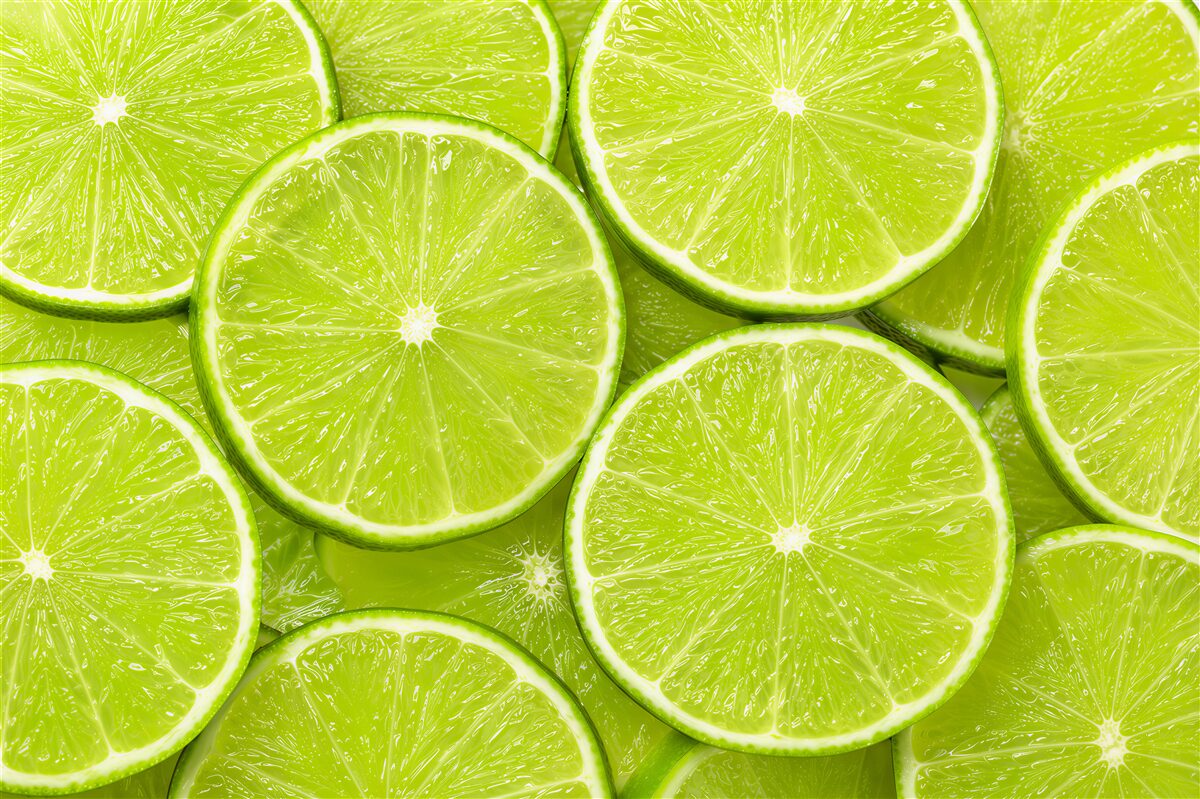 Fototapeten Scheiben von reifen Limetten
