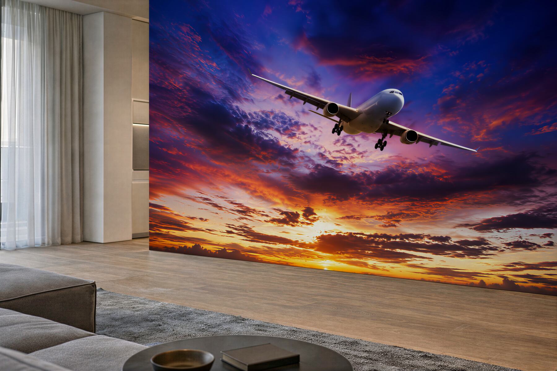 Fototapeten fliegendes Flugzeug vor einem Sonnenuntergangshimmel
